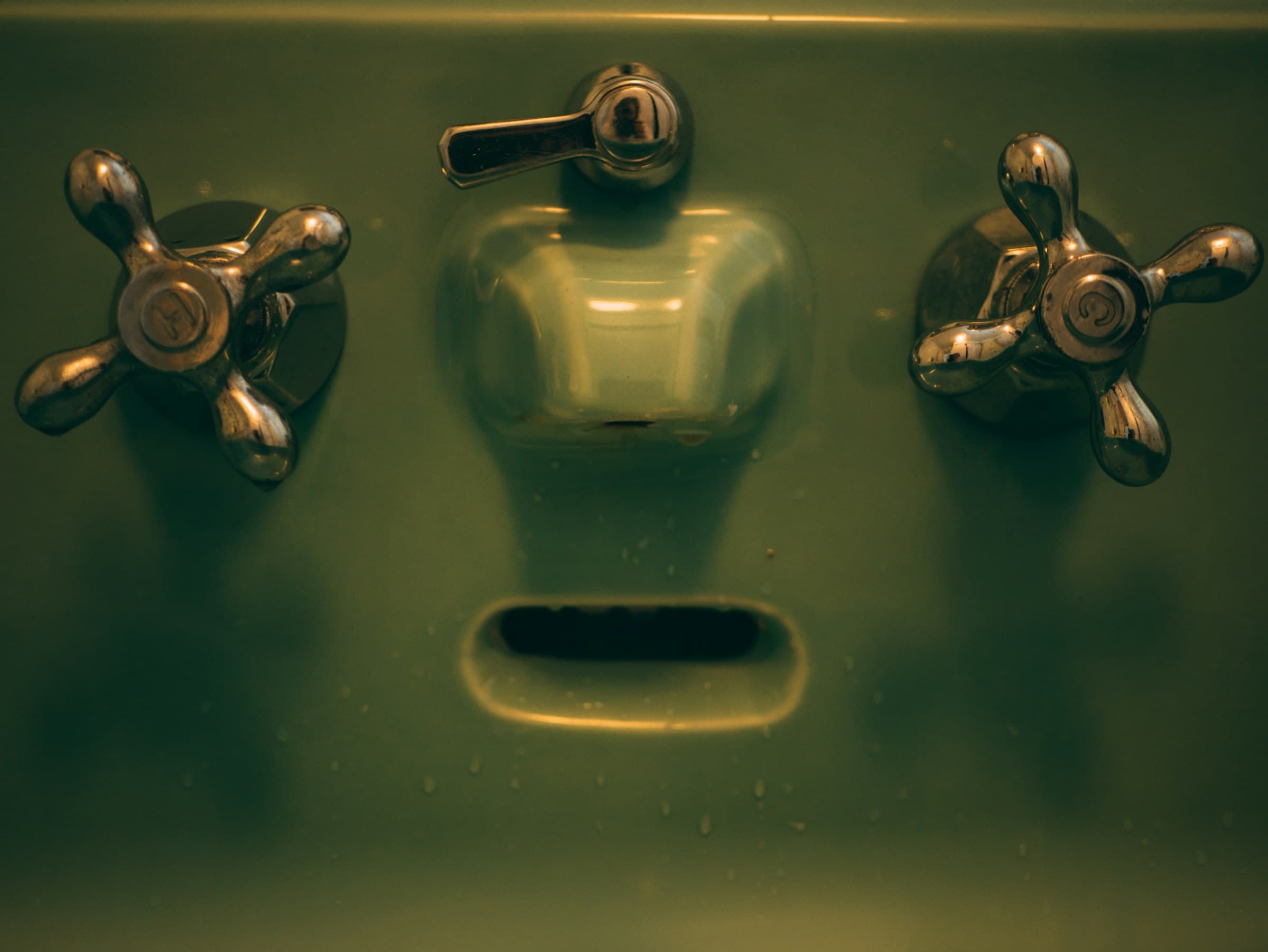 A close-up of a basin and tap