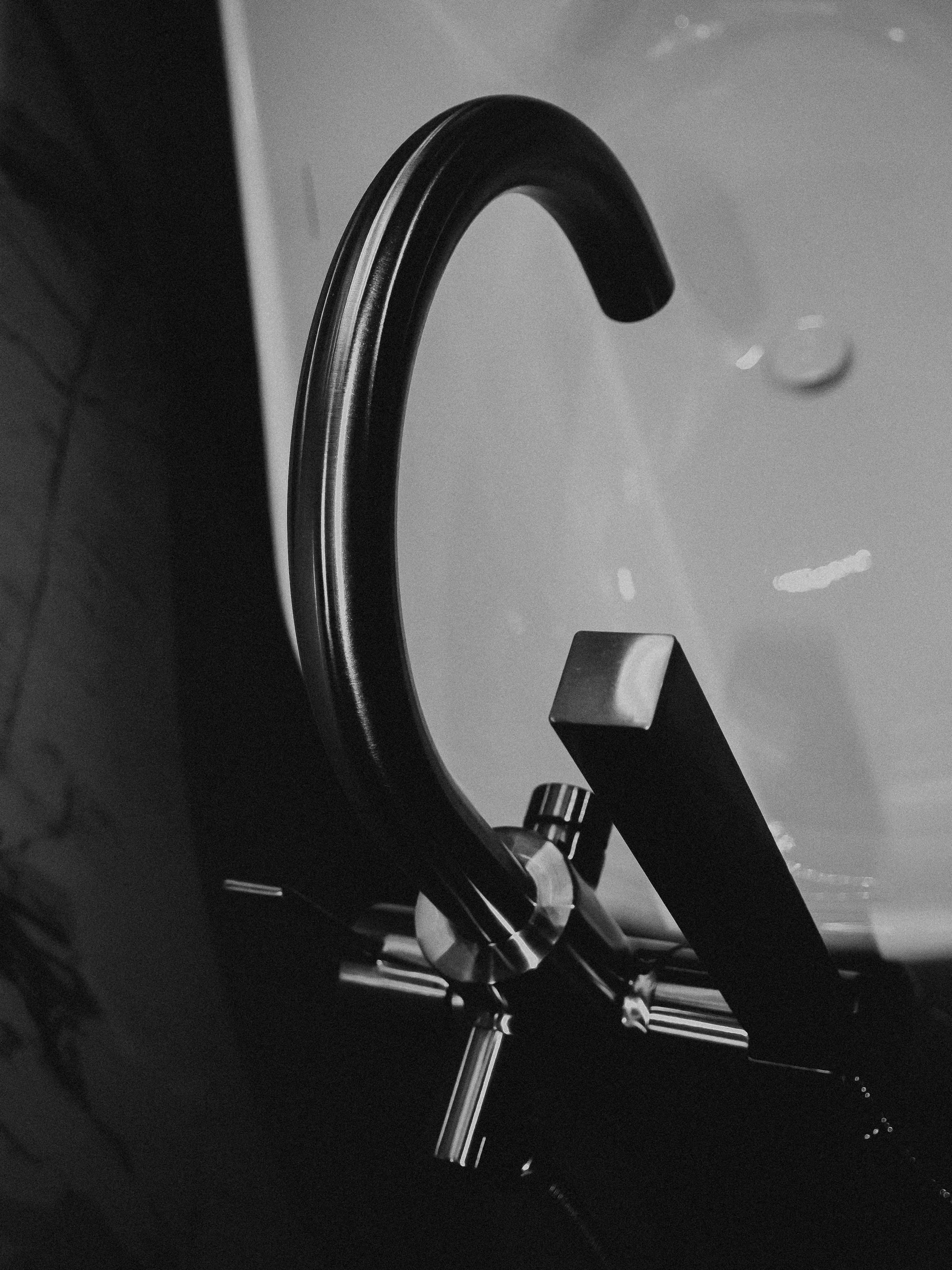 Close-up of a modern mixer tap running water